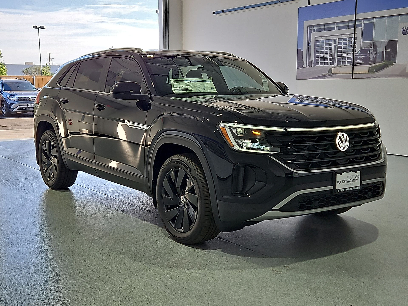 2026 Volkswagen Atlas Cross Sport SE with Technology Deep Black Pearl at Street VW of Amarillo