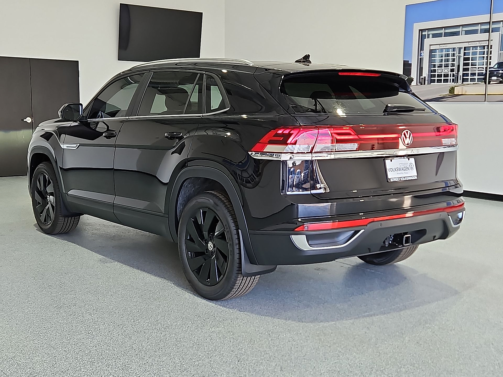2026 Volkswagen Atlas Cross Sport SE with Technology Deep Black Pearl at Street VW of Amarillo