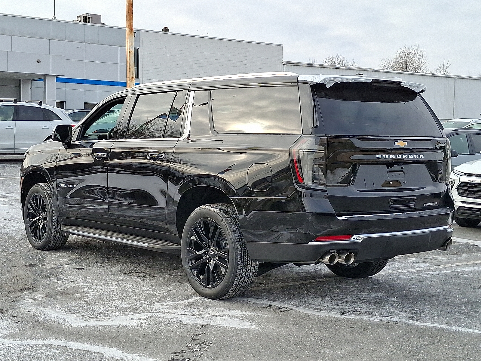 2026 Chevrolet Suburban Premier, 4WD - Black - GBA exterior view 7