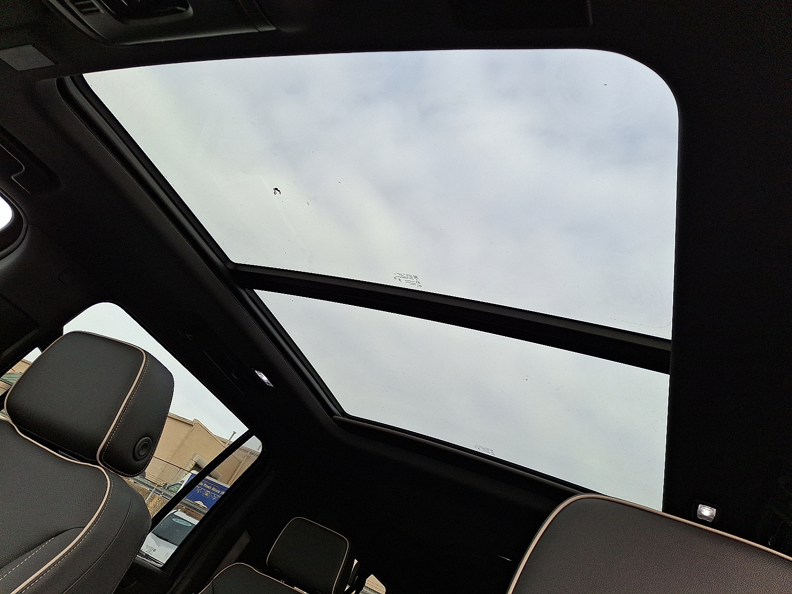 2026 Chevrolet Suburban Premier, 4WD - Black - GBA exterior view 2